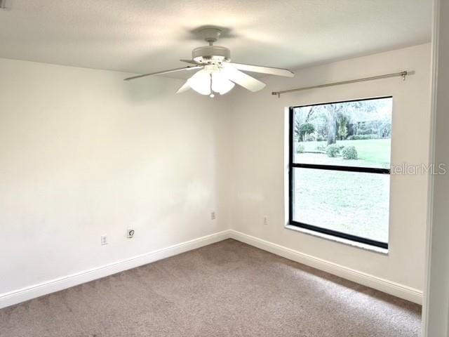 11315 Cypress Shore Ct, Clermont, FL 34711 - carpeted empty room with baseboards and ceiling fan