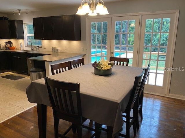 1616 NW 39th Ave, Gainesville, FL 32605 - dining room with a chandelier and dark wood-style flooring