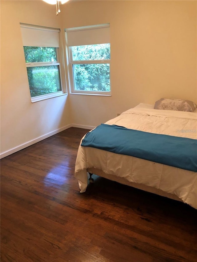 1616 NW 39th Ave, Gainesville, FL 32605 - bedroom featuring wood finished floors and multiple windows
