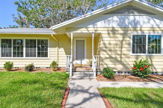3001 Bay Shore Cir, Sarasota, FL 34234 - entrance to property featuring crawl space and a lawn