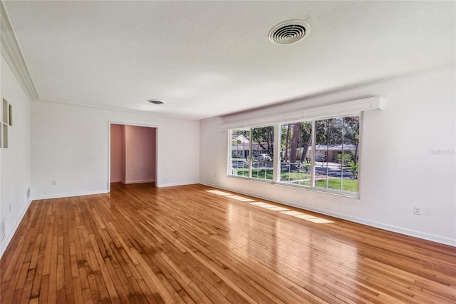 3001 Bay Shore Cir, Sarasota, FL 34234 - spare room featuring hardwood / wood-style flooring and baseboards
