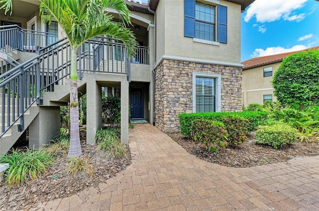 13609 Messina Loop Unit 104, Bradenton, FL 34211 - property entrance with stone siding and stucco siding