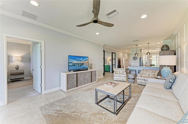 13609 Messina Loop Unit 104, Bradenton, FL 34211 - living room with ornamental molding, recessed lighting, ceiling fan, baseboards, and light tile patterned floors