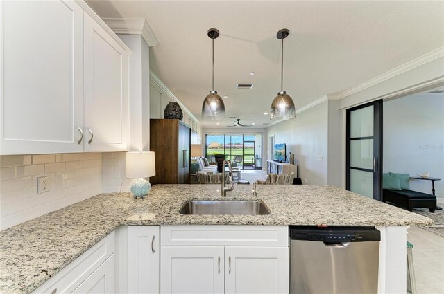 13609 Messina Loop Unit 104, Bradenton, FL 34211 - kitchen with dishwasher, a sink, a peninsula, ornamental molding, and white cabinetry