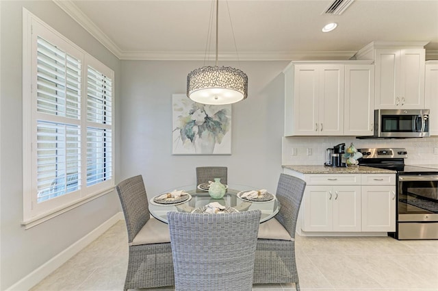 13609 Messina Loop Unit 104, Bradenton, FL 34211 - dining room with healthy amount of natural light, light tile patterned floors, ornamental molding, and baseboards