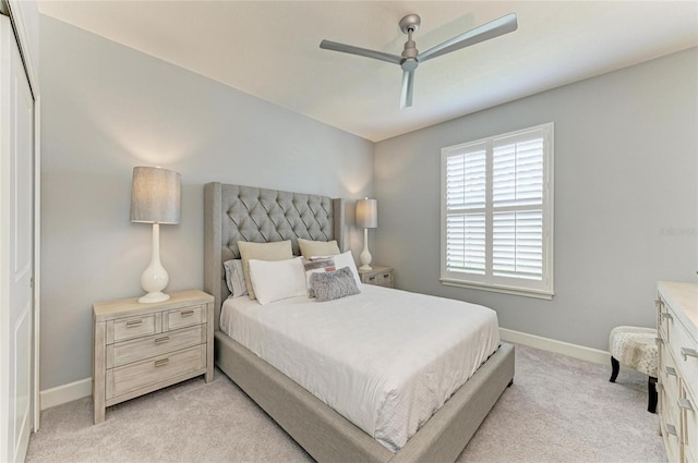 13609 Messina Loop Unit 104, Bradenton, FL 34211 - bedroom featuring light colored carpet, baseboards, and ceiling fan