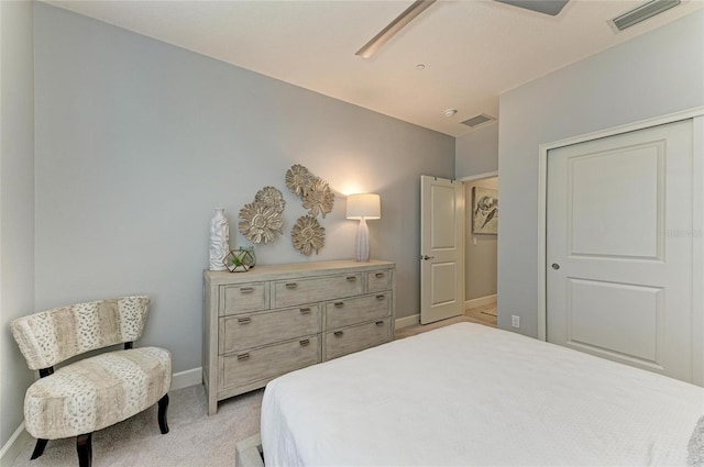13609 Messina Loop Unit 104, Bradenton, FL 34211 - bedroom with light colored carpet, baseboards, and a closet
