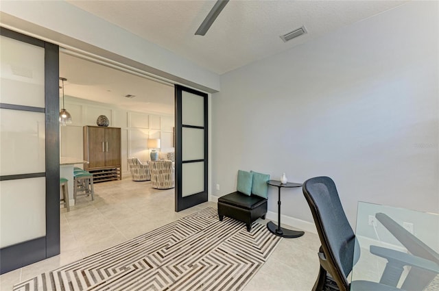 13609 Messina Loop Unit 104, Bradenton, FL 34211 - office space featuring light tile patterned floors, ceiling fan, and baseboards