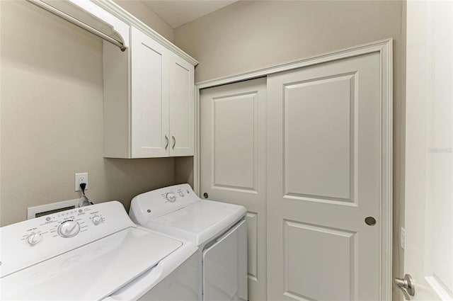 13609 Messina Loop Unit 104, Bradenton, FL 34211 - laundry room featuring cabinet space and washer and clothes dryer