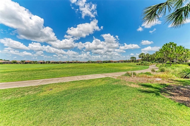 13609 Messina Loop Unit 104, Bradenton, FL 34211 - surrounding community featuring a lawn