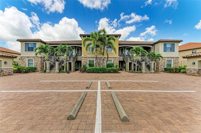 13609 Messina Loop Unit 104, Bradenton, FL 34211 - view of property with stairway and uncovered parking