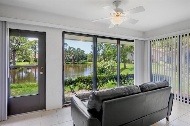 3362 Sandleheath Unit 12, Sarasota, FL 34235 - sunroom with a water view, healthy amount of natural light, and tile patterned floors
