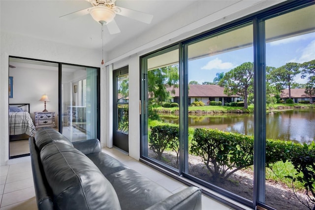 3362 Sandleheath Unit 12, Sarasota, FL 34235 - sunroom with a water view and tile patterned floors