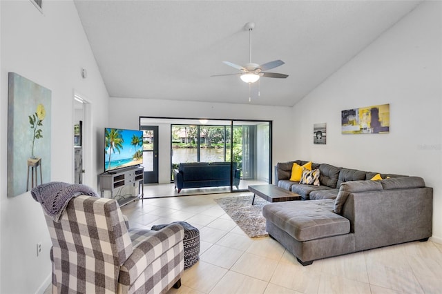 3362 Sandleheath Unit 12, Sarasota, FL 34235 - living area with high vaulted ceiling, ceiling fan, light tile patterned floors, and baseboards