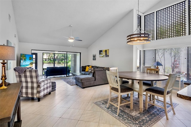 3362 Sandleheath Unit 12, Sarasota, FL 34235 - dining room featuring high vaulted ceiling, a ceiling fan, and light tile patterned floors