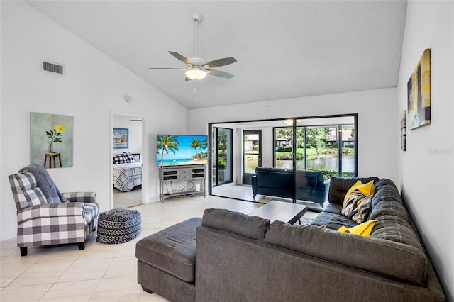 3362 Sandleheath Unit 12, Sarasota, FL 34235 - living room with light tile patterned floors, high vaulted ceiling, and a ceiling fan