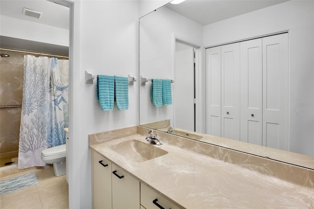 3362 Sandleheath Unit 12, Sarasota, FL 34235 - bathroom with a closet, vanity, toilet, and a shower stall