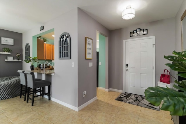 8937 Excelsior Loop, Venice, FL 34293 - foyer featuring light tile patterned floors and baseboards