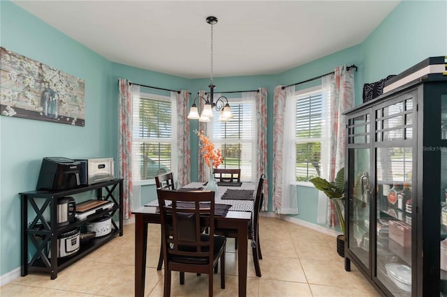 8937 Excelsior Loop, Venice, FL 34293 - dining room featuring a chandelier, healthy amount of natural light, light tile patterned floors, and baseboards