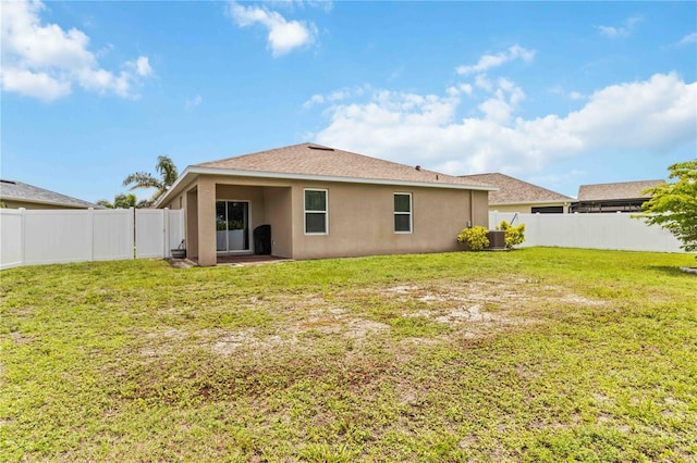 8937 Excelsior Loop, Venice, FL 34293 - rear view of house with stucco siding, central AC unit, and a patio