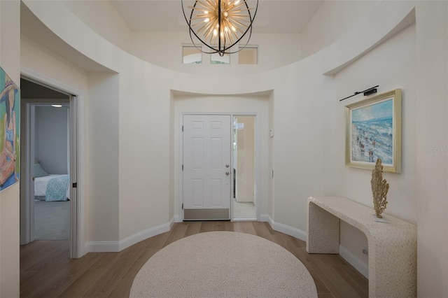 7952 Hampton Ct, University Park, FL 34201 - entryway featuring a chandelier, wood finished floors, and baseboards