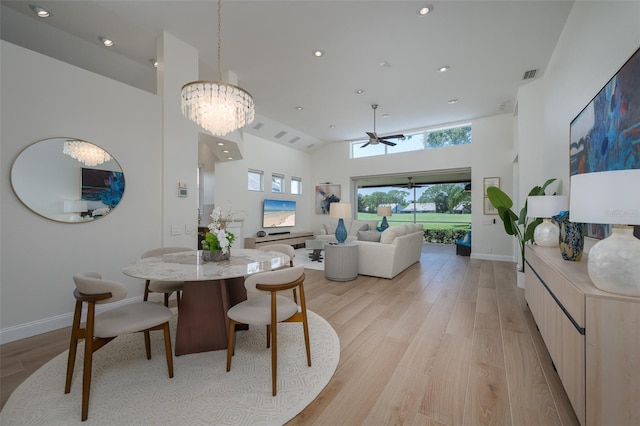 7952 Hampton Ct, University Park, FL 34201 - dining area featuring light wood-type flooring, recessed lighting, a high ceiling, a ceiling fan, and baseboards
