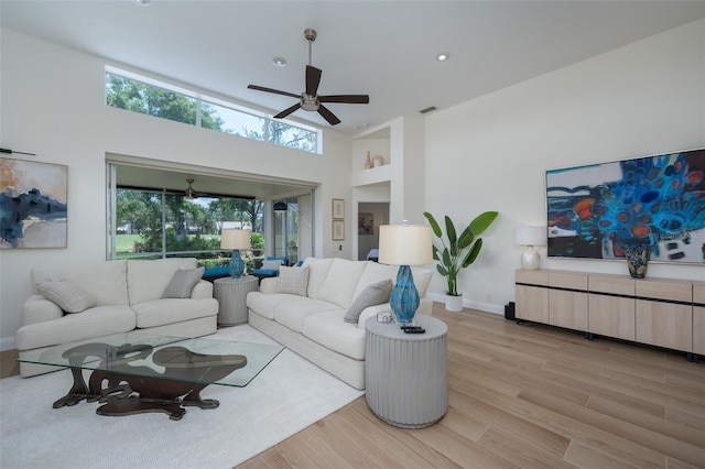 7952 Hampton Ct, University Park, FL 34201 - living area with ceiling fan, light wood finished floors, baseboards, a towering ceiling, and recessed lighting