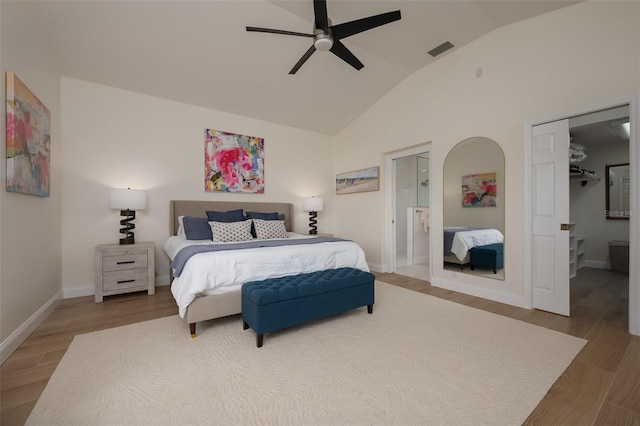 7952 Hampton Ct, University Park, FL 34201 - bedroom with lofted ceiling, wood finished floors, baseboards, connected bathroom, and a ceiling fan