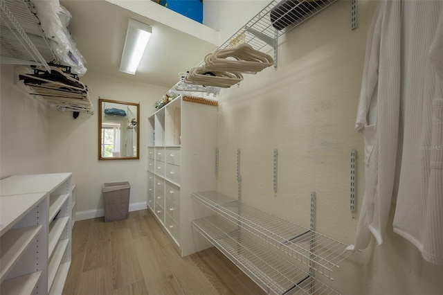 7952 Hampton Ct, University Park, FL 34201 - walk in closet featuring light wood finished floors