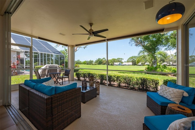 7952 Hampton Ct, University Park, FL 34201 - sunroom / solarium featuring a ceiling fan and an outdoor hangout area