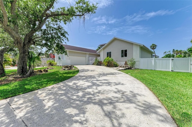 3903 Bayside Dr, Bradenton, FL 34210 - single story home with driveway, a garage, and a gate