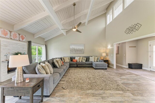 3903 Bayside Dr, Bradenton, FL 34210 - living room with wood finished floors, plenty of natural light, high vaulted ceiling, wooden ceiling with exposed beams, and baseboards