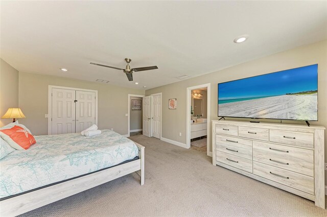 3903 Bayside Dr, Bradenton, FL 34210 - bedroom featuring light carpet, baseboards, ensuite bathroom, ceiling fan, and recessed lighting