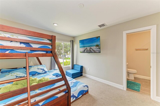 3903 Bayside Dr, Bradenton, FL 34210 - bedroom with baseboards, carpet floors, ensuite bathroom, and recessed lighting