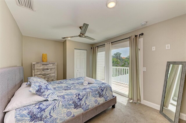 3903 Bayside Dr, Bradenton, FL 34210 - bedroom with access to outside, carpet, baseboards, a closet, and ceiling fan