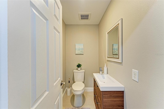 3903 Bayside Dr, Bradenton, FL 34210 - half bath featuring vanity, toilet, tile patterned floors, and baseboards