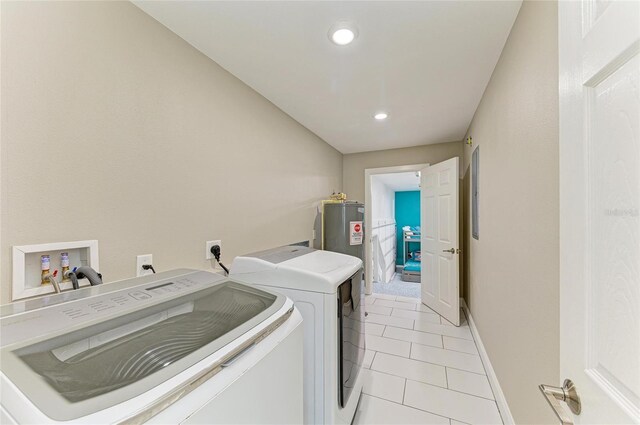 3903 Bayside Dr, Bradenton, FL 34210 - laundry room with separate washer and dryer, electric water heater, light tile patterned floors, recessed lighting, and baseboards