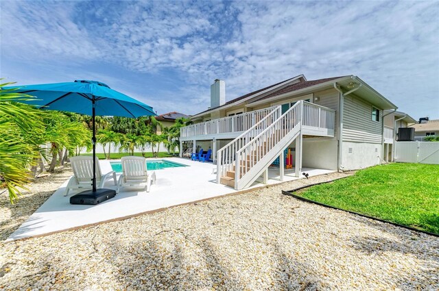 3903 Bayside Dr, Bradenton, FL 34210 - rear view of house featuring a patio, stairway, and a wooden deck