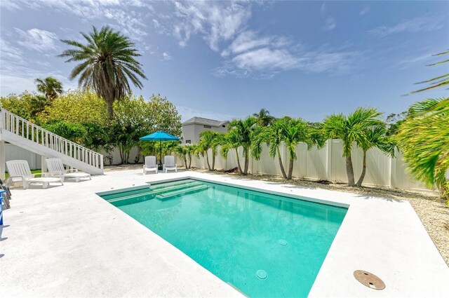 3903 Bayside Dr, Bradenton, FL 34210 - view of swimming pool with a patio area, a fenced backyard, and stairs