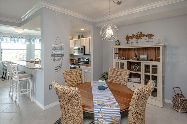 7005 River Hammock Dr Unit 303, Bradenton, FL 34212 - dining area with light tile patterned floors, ornamental molding, a chandelier, and baseboards