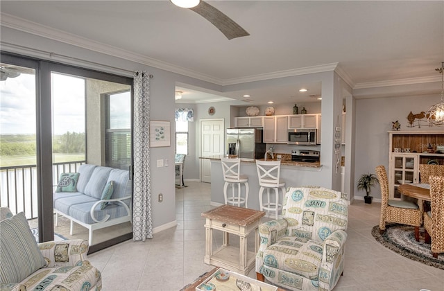 7005 River Hammock Dr Unit 303, Bradenton, FL 34212 - living area with light tile patterned floors, ornamental molding, a ceiling fan, baseboards, and recessed lighting