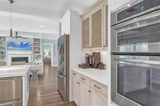 510 Wedge Ln, Longboat Key, FL 34228 - kitchen with stainless steel appliances, dark wood finished floors, a fireplace, ceiling fan, and wood ceiling with exposed beams