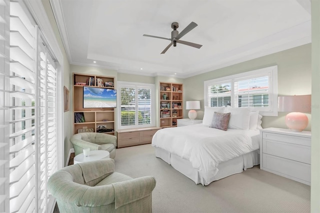 510 Wedge Ln, Longboat Key, FL 34228 - carpeted bedroom with multiple windows, a tray ceiling, ornamental molding, a ceiling fan, and recessed lighting