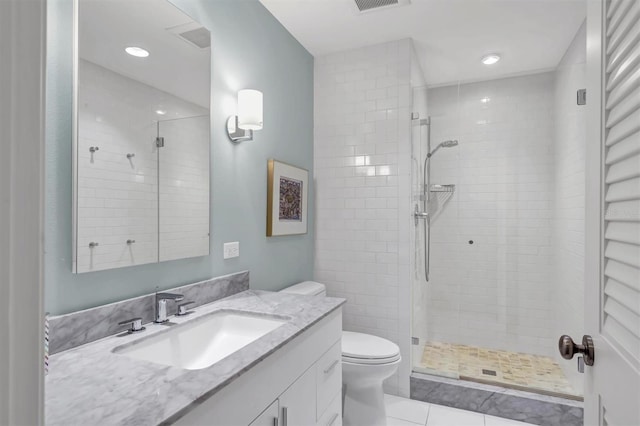 510 Wedge Ln, Longboat Key, FL 34228 - bathroom featuring toilet, vanity, a shower stall, a towel warmer, and tile patterned flooring