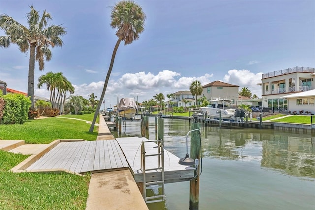 510 Wedge Ln, Longboat Key, FL 34228 - dock area with a water view, a lawn, boat lift, and a residential view