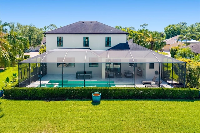 826 Honeyflower Loop, Bradenton, FL 34212 - rear view of house featuring a patio, a yard, and a shingled roof