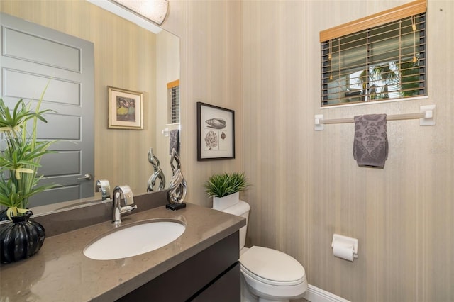 826 Honeyflower Loop, Bradenton, FL 34212 - half bath featuring wallpapered walls and vanity