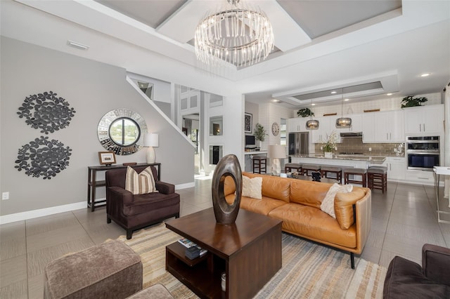 826 Honeyflower Loop, Bradenton, FL 34212 - living room with light tile patterned floors, a tray ceiling, a chandelier, and recessed lighting
