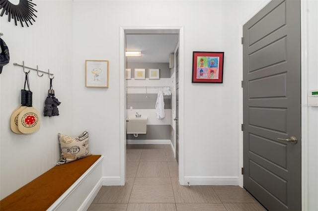 826 Honeyflower Loop, Bradenton, FL 34212 - mudroom featuring baseboards and tile patterned floors