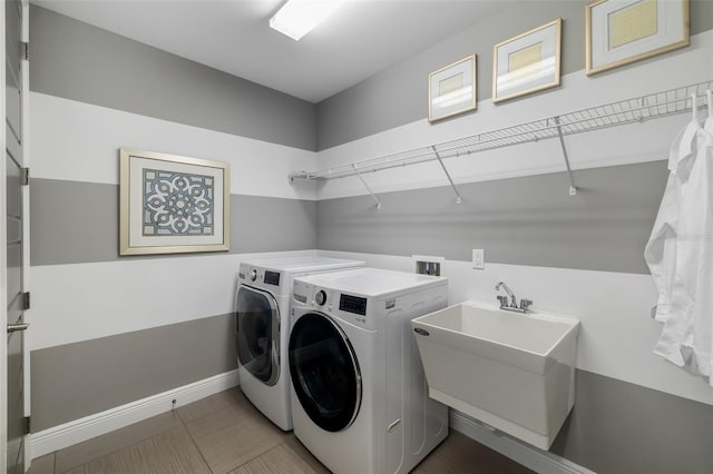826 Honeyflower Loop, Bradenton, FL 34212 - laundry room with washer and clothes dryer and baseboards